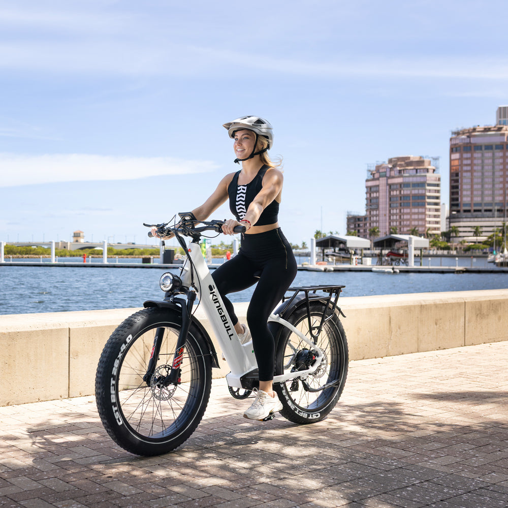 The Kingbull Discover ST 2.0 being ridden on a paved waterfront path
